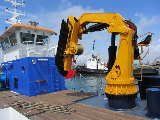 Reliable and Safe Operations Small Fisherman Loading Fish at Port Fish Bag Moving Crane